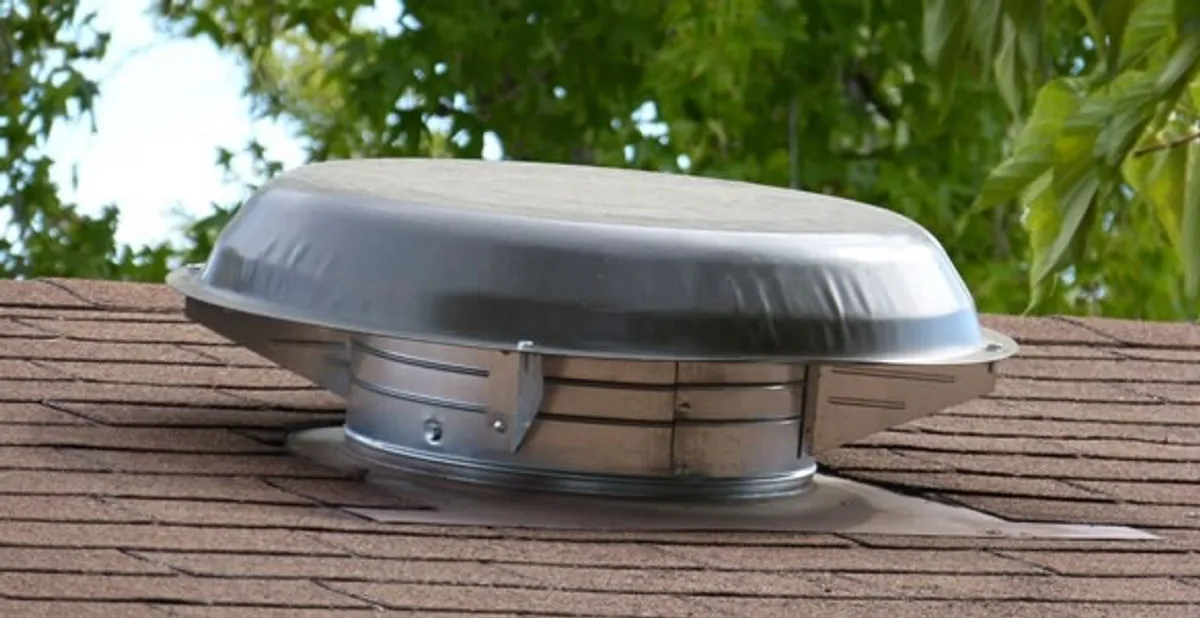 attic fan installation services with low-profile roof ventilation unit in Madison, WI