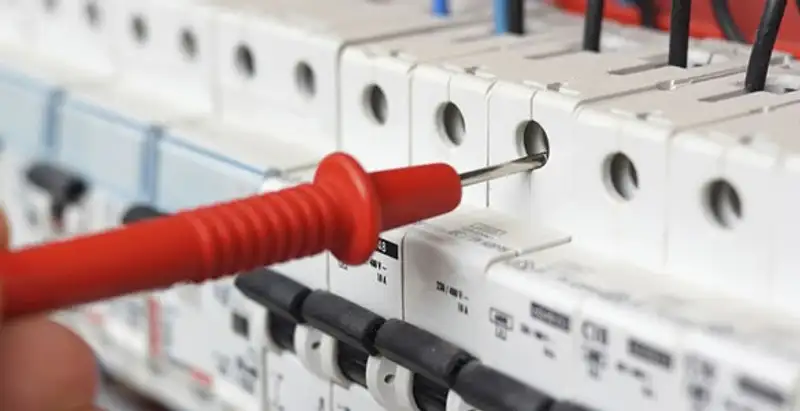 Electrical contractor testing circuit breakers during electrical repair in Oregon, WI