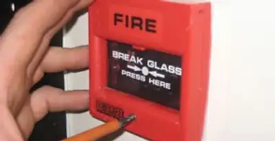 fire alarm installation service showing manual fire alarm pull station installed by licensed electricians in Madison, WI