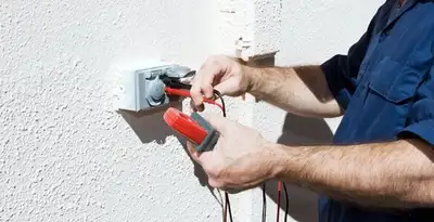 Electrician performing home electrical outlet and wiring inspection in Madison, WI