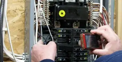 Home electrical inspection of circuit breaker panel by licensed electrician in Madison, WI