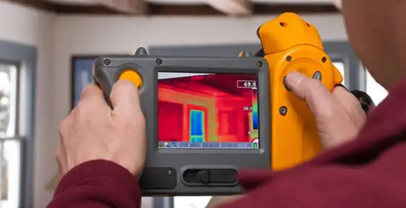 home energy audit service capturing thermal readings to analyze insulation and electrical efficiency in Madison, WI