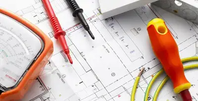 licensed electrician planning and testing electrical systems using professional tools in Madison, WI