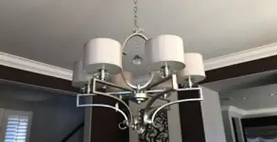 Modern chandelier installation with multiple light fixtures in Madison, WI