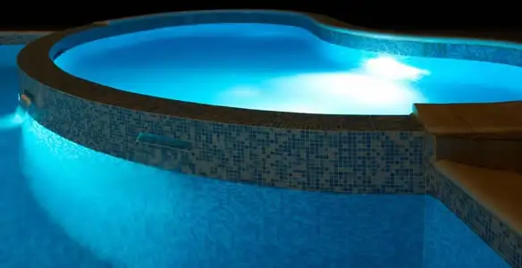 pool light installation and repair services highlighting illuminated pool interior lighting in Madison, WI