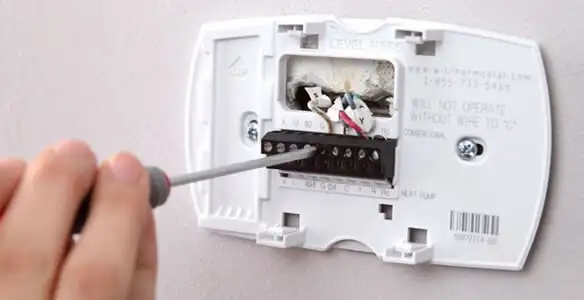 Thermostat installation service with proper wiring and secure wall mounting in Madison, WI